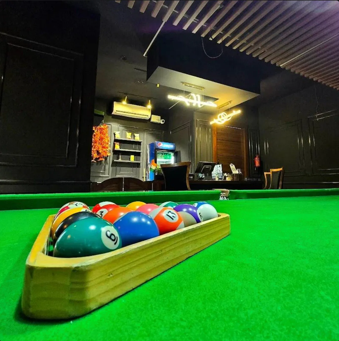 Racked pool balls on an open table